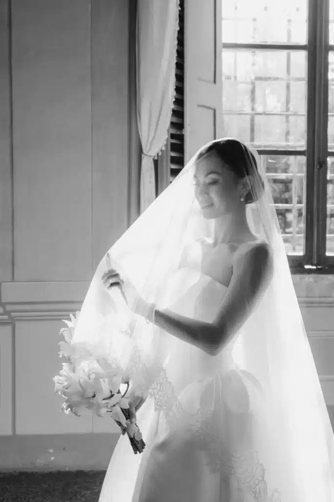 Black and white bridal veil portrait at wedding in Italy