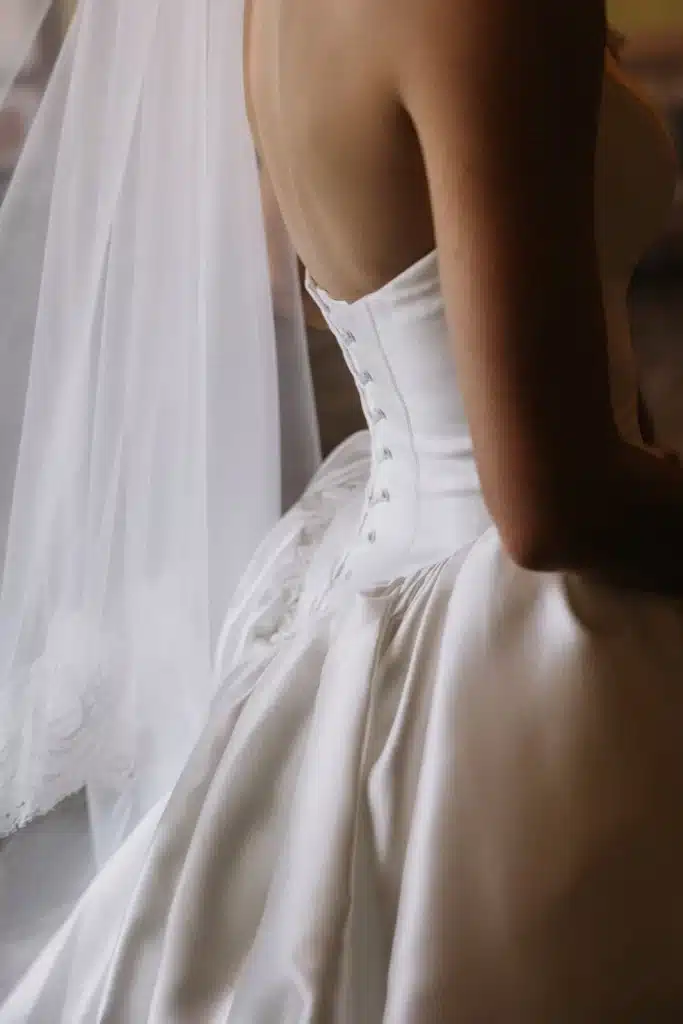 Wedding dress corset detail photographed at ceremony in Italy