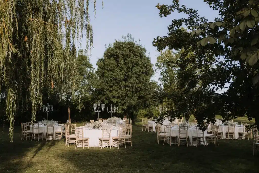 Outdoor reception setup in garden estate for wedding in England