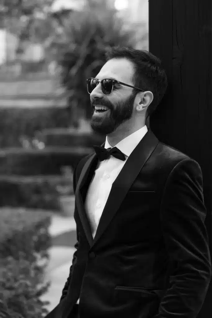 Black and white groom portrait at a destination wedding in England