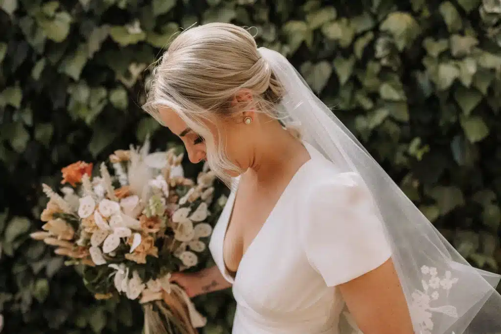 bride with veil in la pescaia in maremma, Tuscany destination wedding