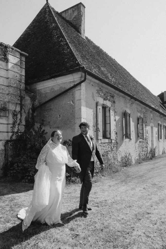 Embroidered Atelier Blanche wedding dress worn by the bride at Château de Saint-Georges
