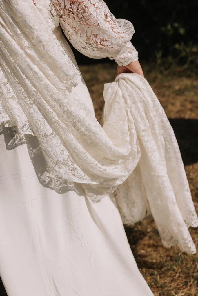 Embroidered Atelier Blanche wedding dress worn by the bride at Château de Saint-Georges