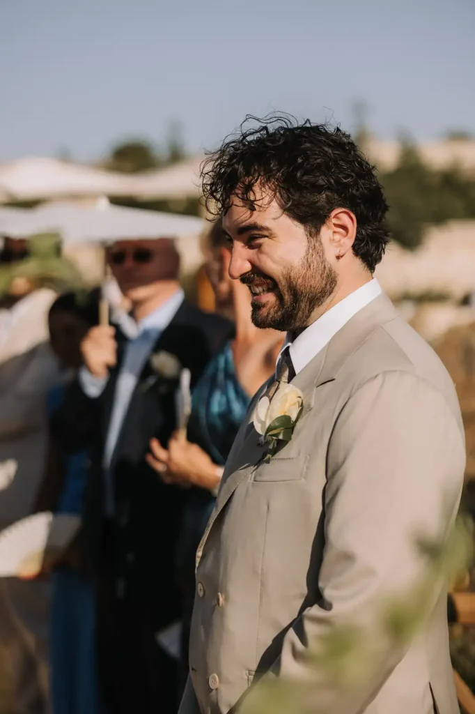 Portrait of the groom during an outdoor wedding ceremony at Villa Càrcara in Sicily