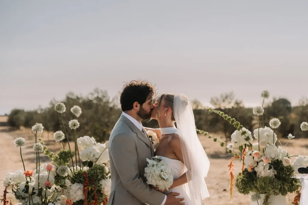 Couple kissing during their destination wedding at Villa Càrcara in Sicily
