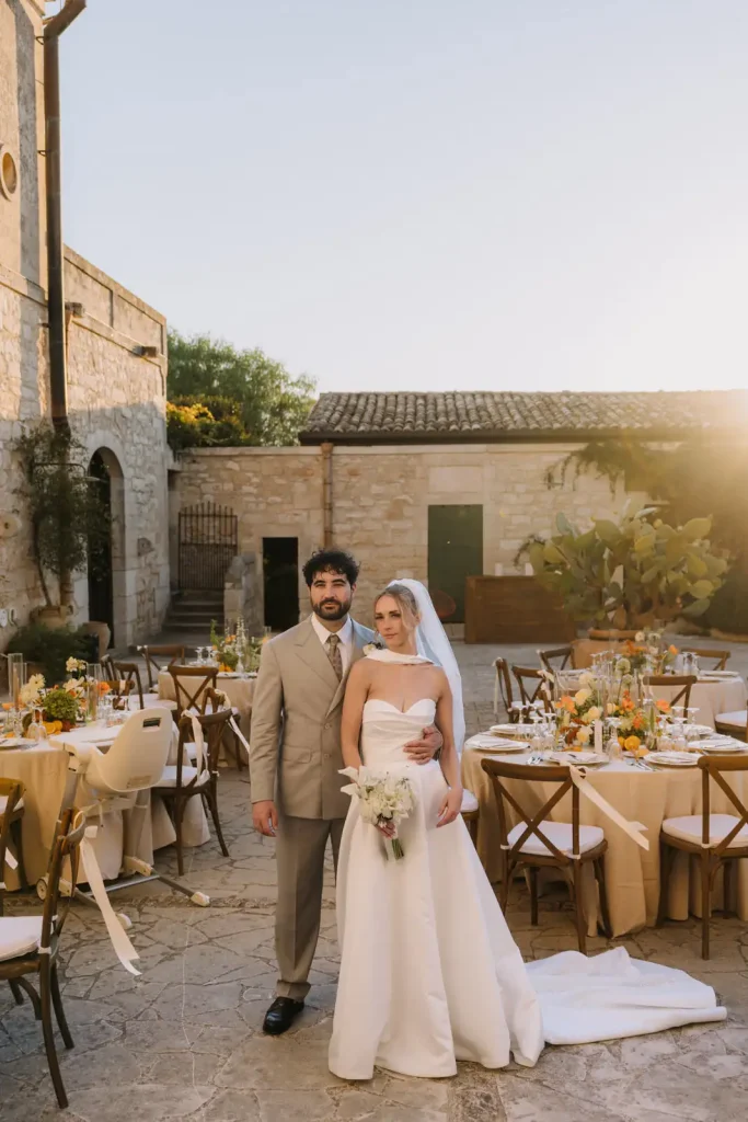 Newlyweds surrounded by the Sicilian countryside during their destination wedding at Villa Càrcara