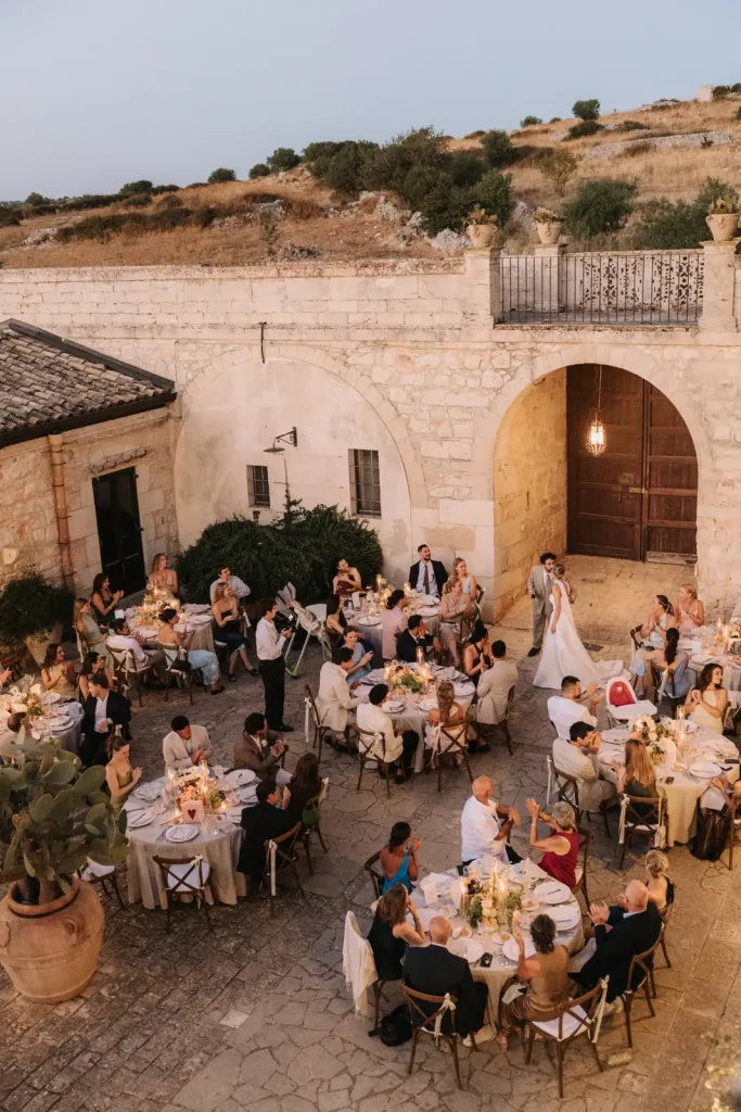 Destination wedding dinner in the courtyard of Villa Càrcara, Sicily